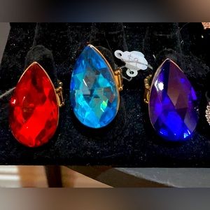 3 Rings- Red, Turquoise and Blue adjustable, stretch band Rings.